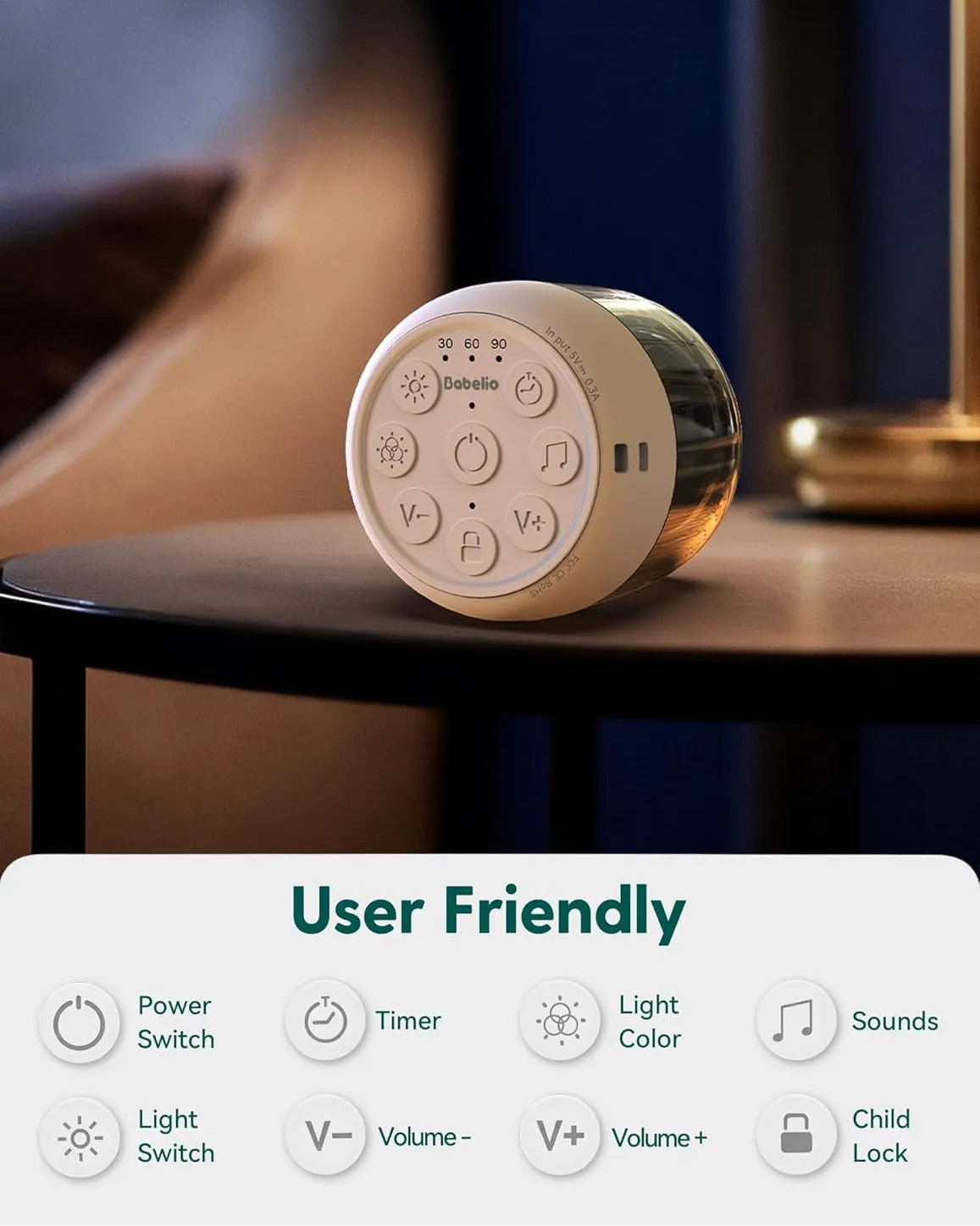 Babelio white noise machine with timer, volume, and light controls on nursery side table