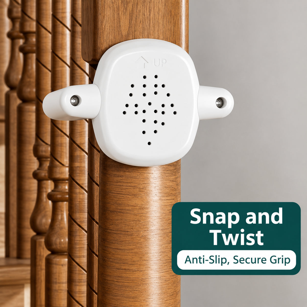 A white baby gate safety clip attached to a wooden stair railing, with a dark green text badge on the bottom right reading 'Snap and Twist Anti-Slip, Secure Grip'.