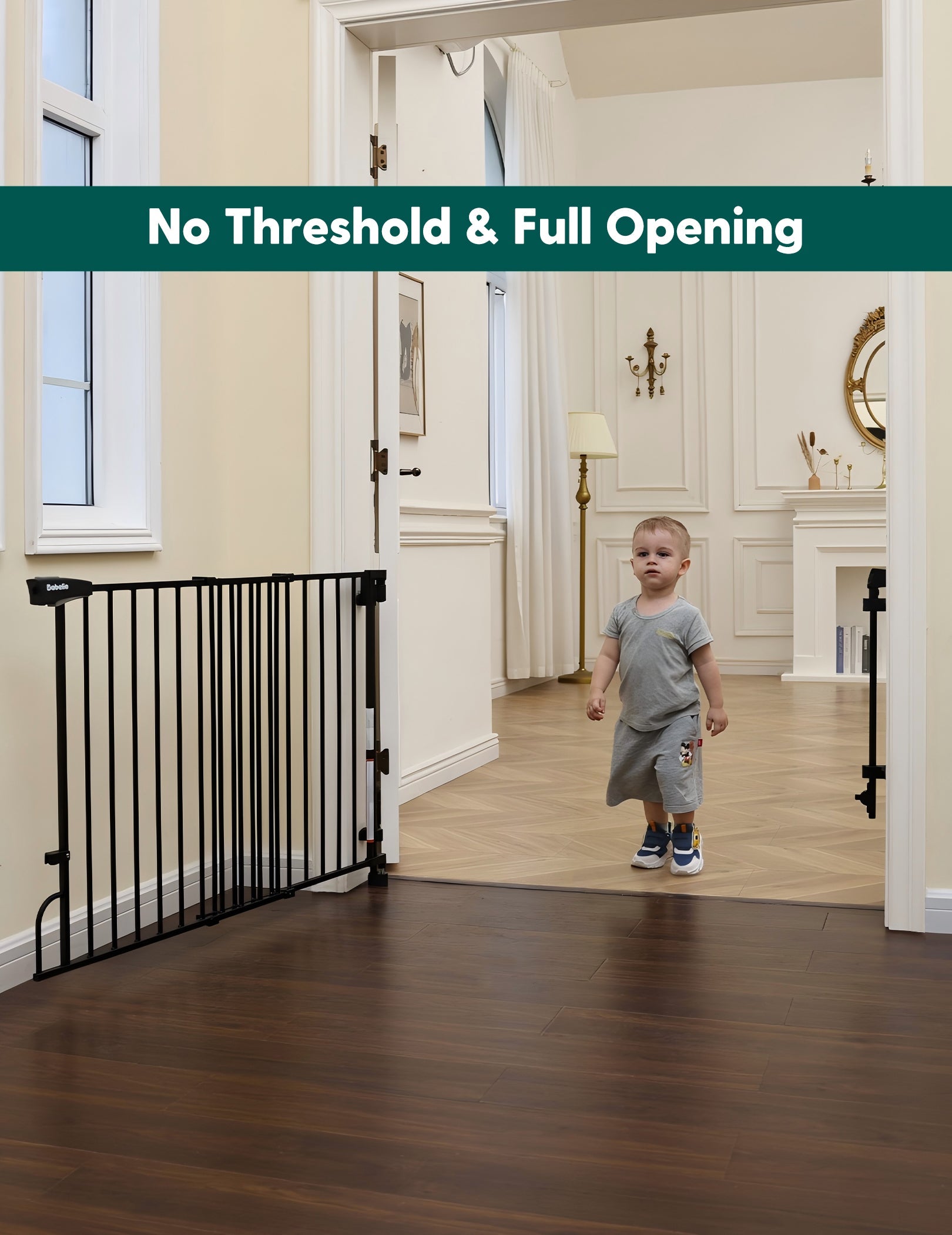 Babelio black baby safety gate installed in a living room doorway with a toddler nearby