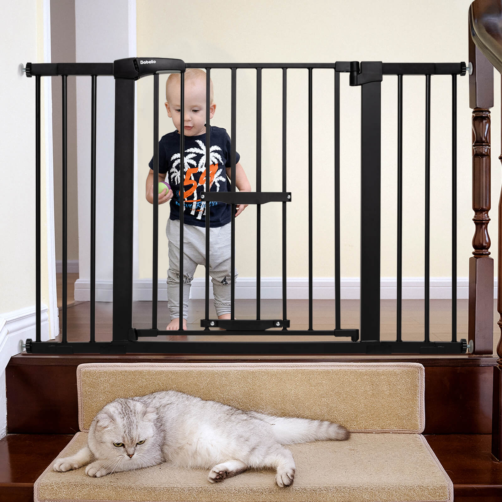 Babelio baby safety gate with adjustable cat door at staircase, baby and cat in hallway
