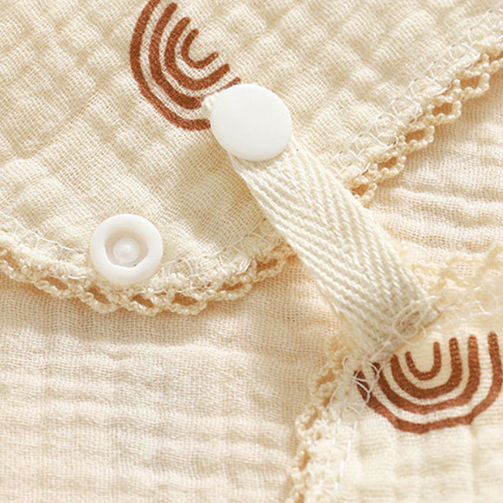 Babelio beige cotton muslin baby bib with snap button and rainbow pattern detail