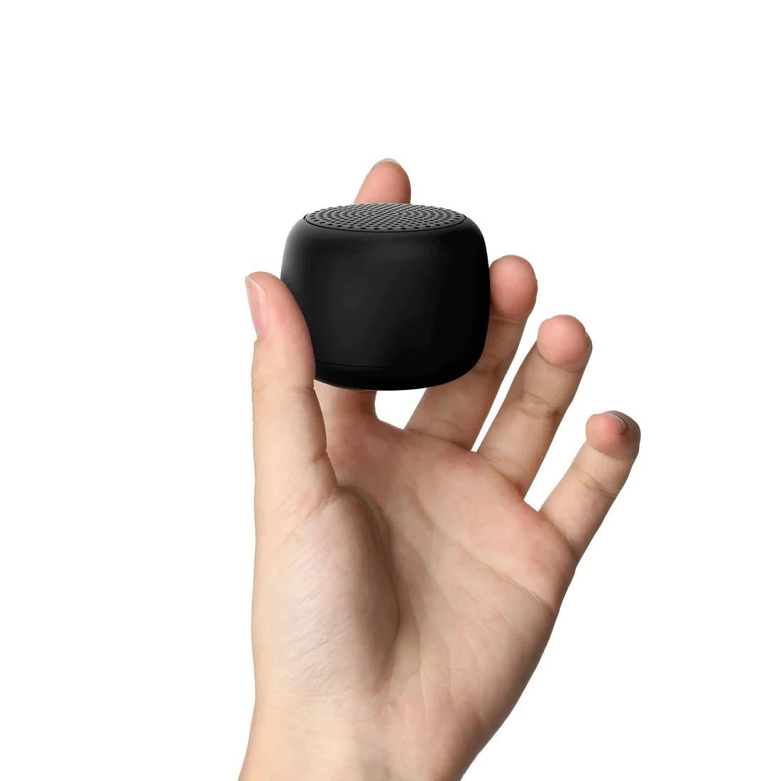 Hand holding a compact black Babelio white noise machine for babies and adults