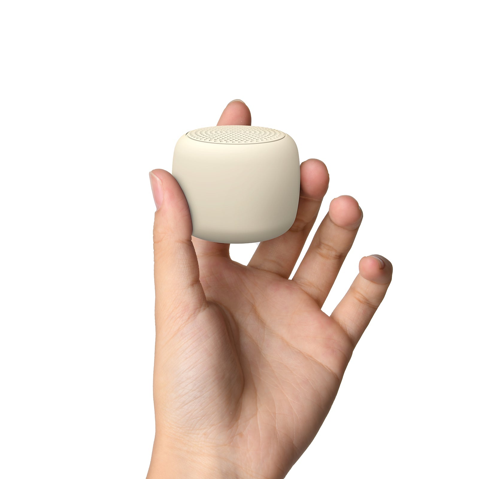 Hand holding a compact Babelio white noise machine for babies against a white background.