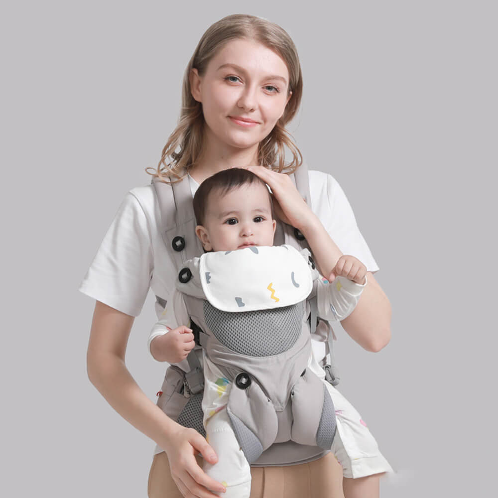 Babelio baby carrier with mother and infant in neutral room setting