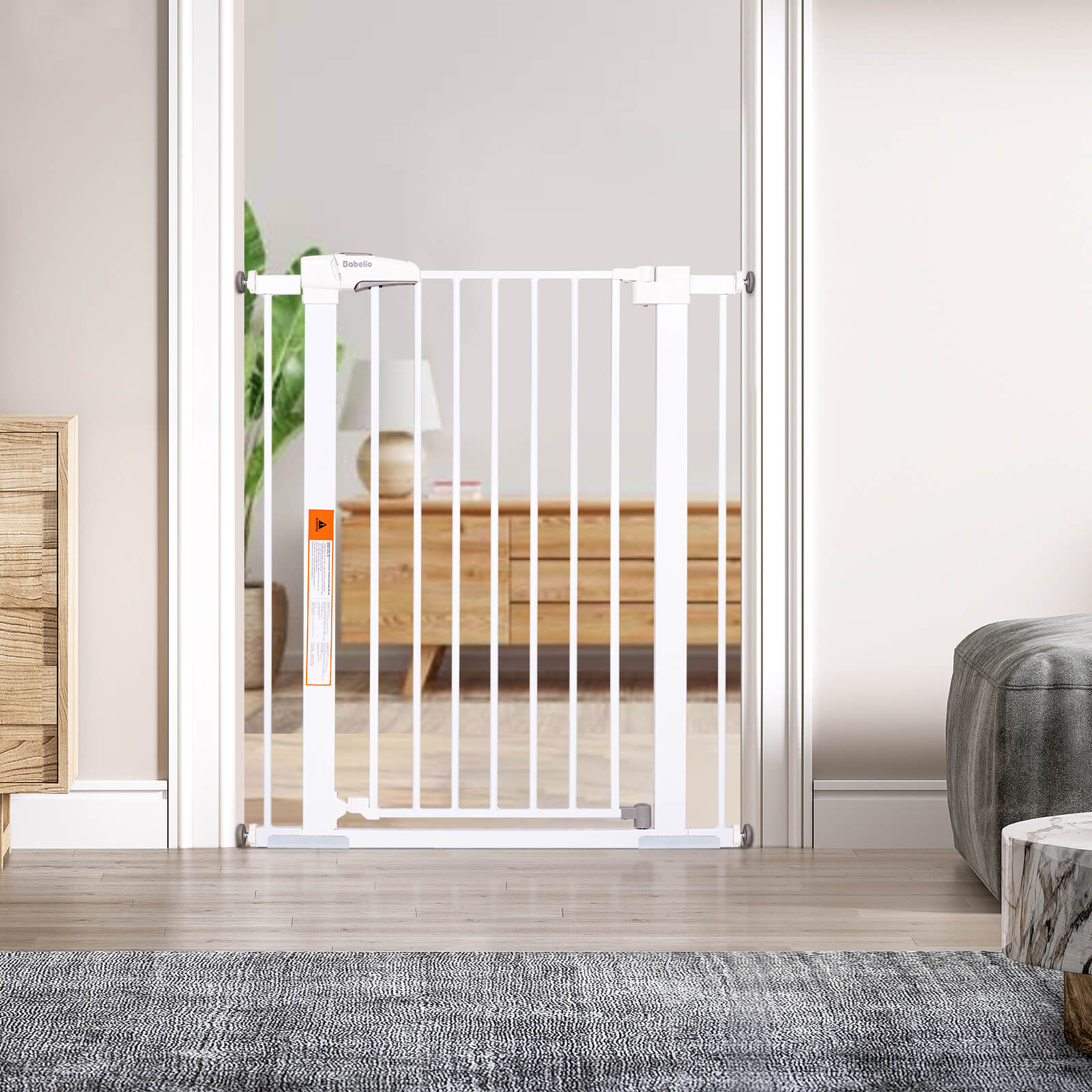 Babelio white baby safety gate installed in a modern living room doorway