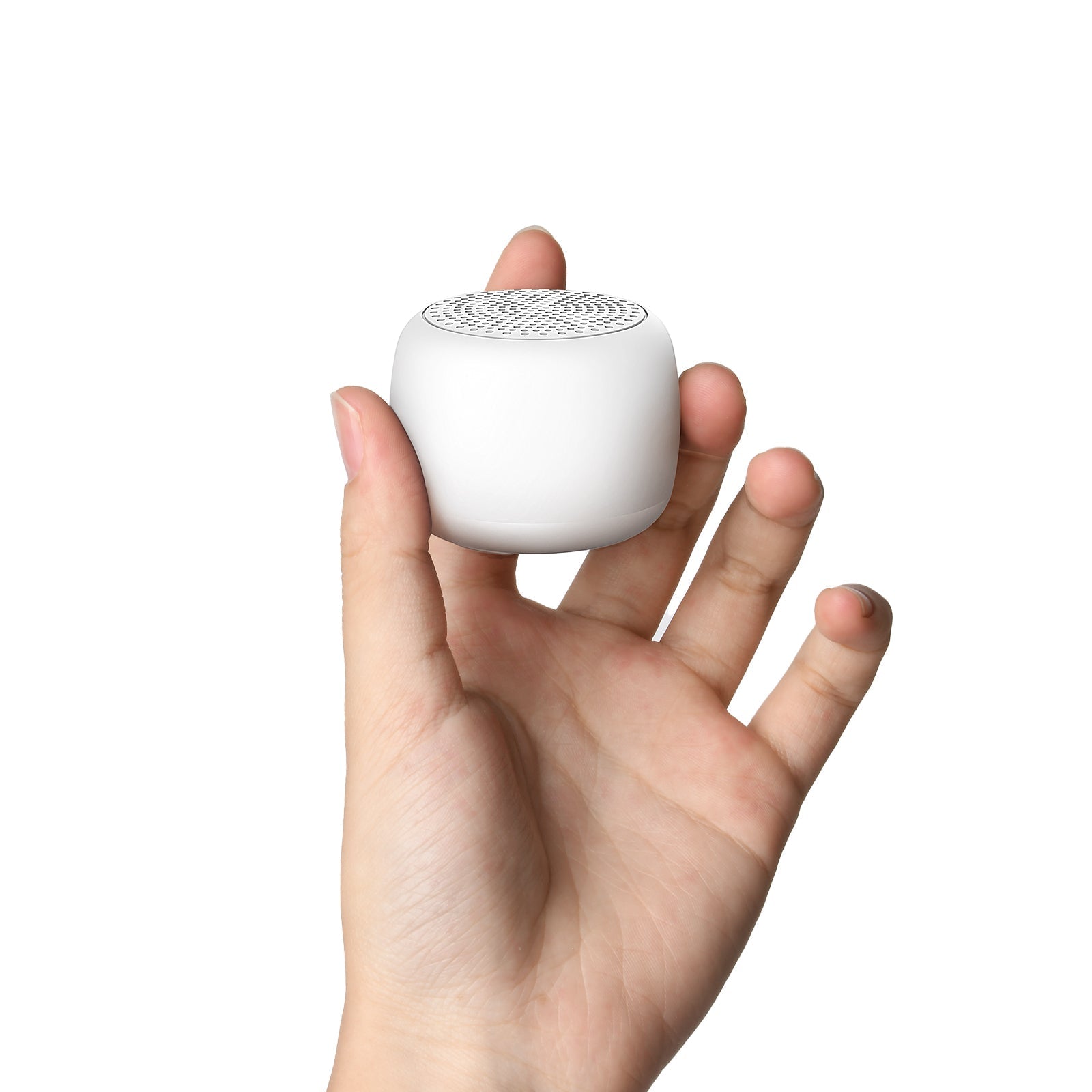 Hand holding a compact Babelio white noise machine for nursery or baby sleep.
