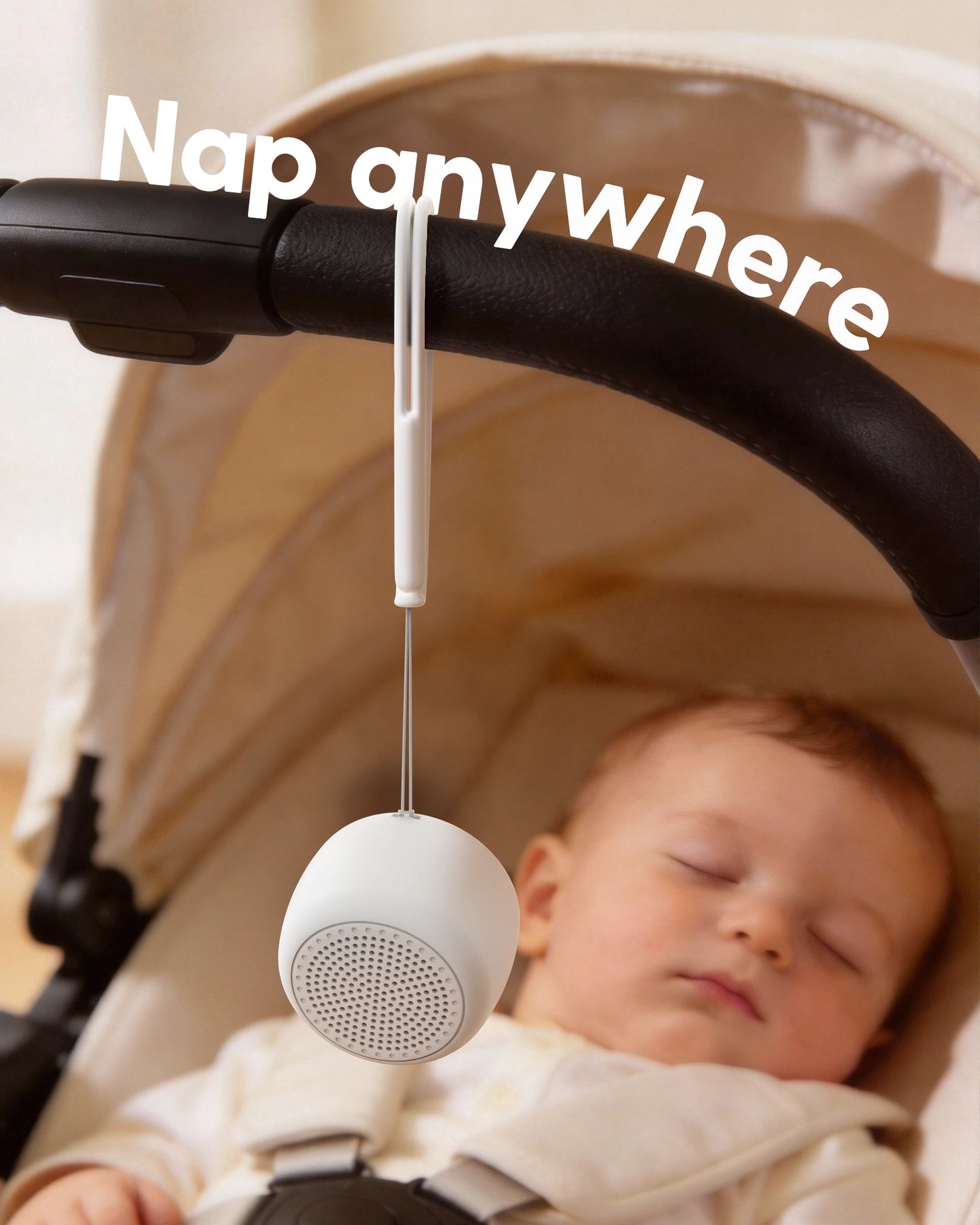 Babelio white noise machine hanging on stroller with sleeping baby, perfect for on-the-go naps.