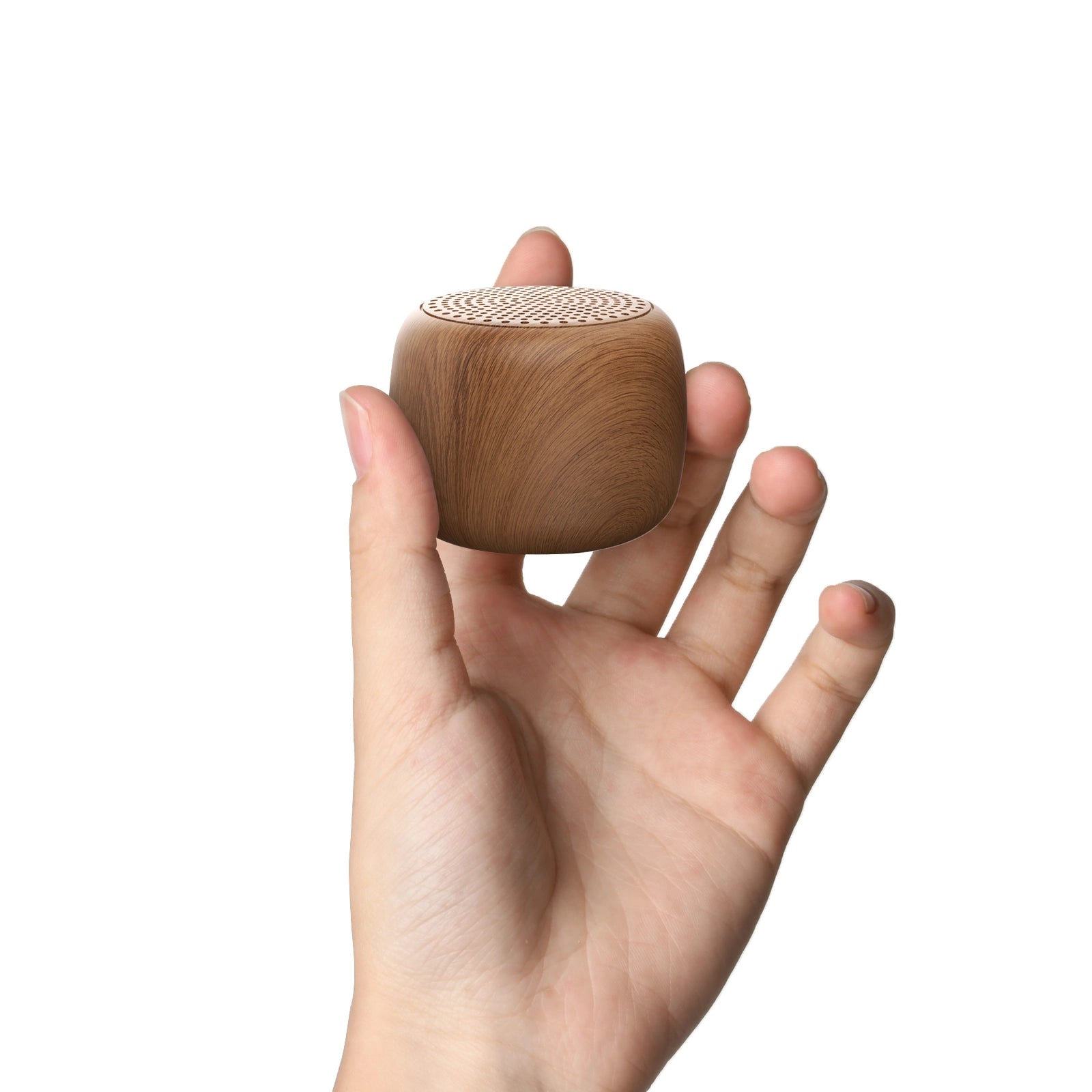 Hand holding a compact Babelio wood grain white noise machine for nursery or bedroom