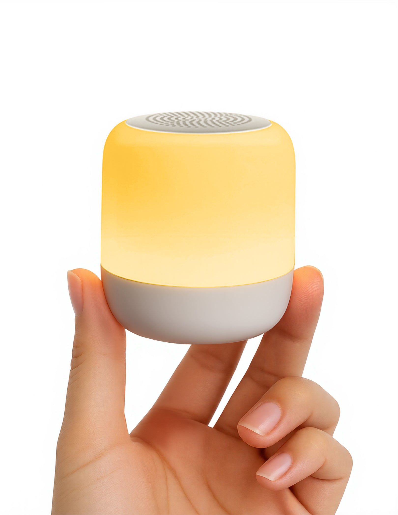 Babelio white noise machine with warm glow, held in hand for nursery use