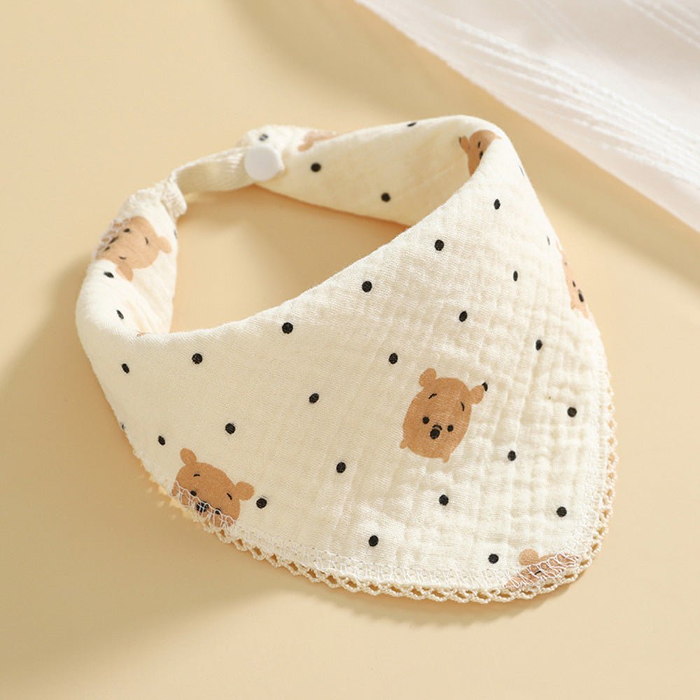 Babelio soft muslin baby bib with bear and dot pattern on beige background