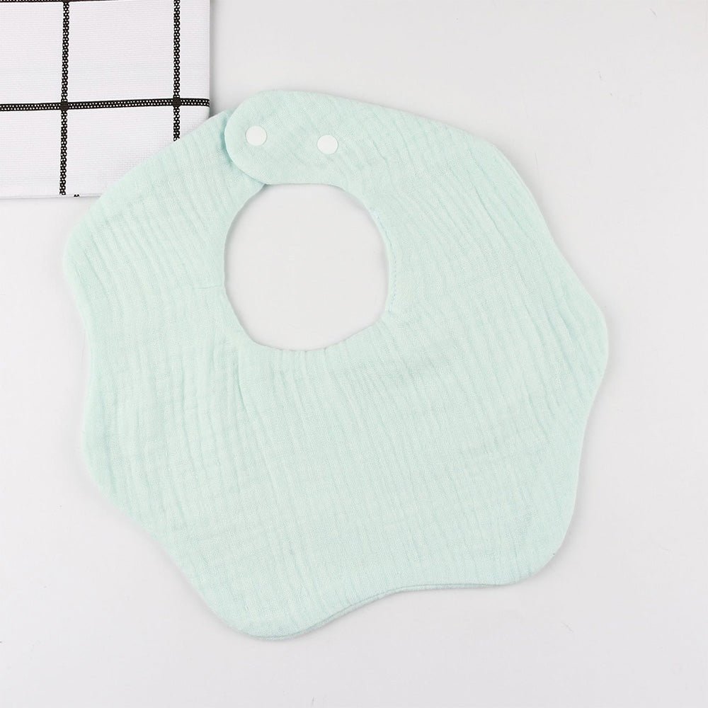 Babelio pastel mint green baby bib with snap buttons on white background
