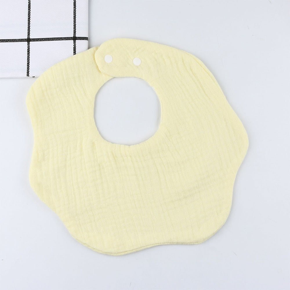 Babelio yellow solid color baby bib with snap buttons on a white background.