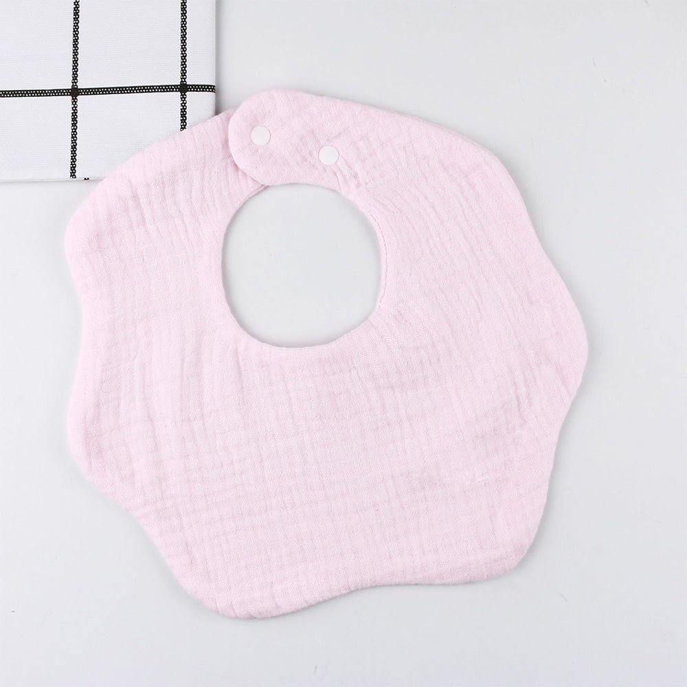 Babelio soft pink baby bib with snap buttons on a white background, nursery accessory