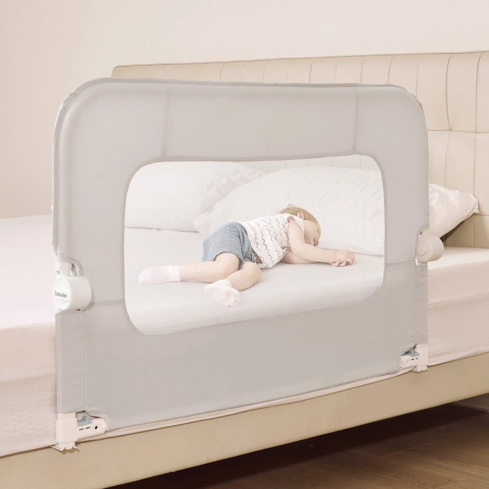 Babelio baby safety gate on bed with sleeping toddler in modern bedroom